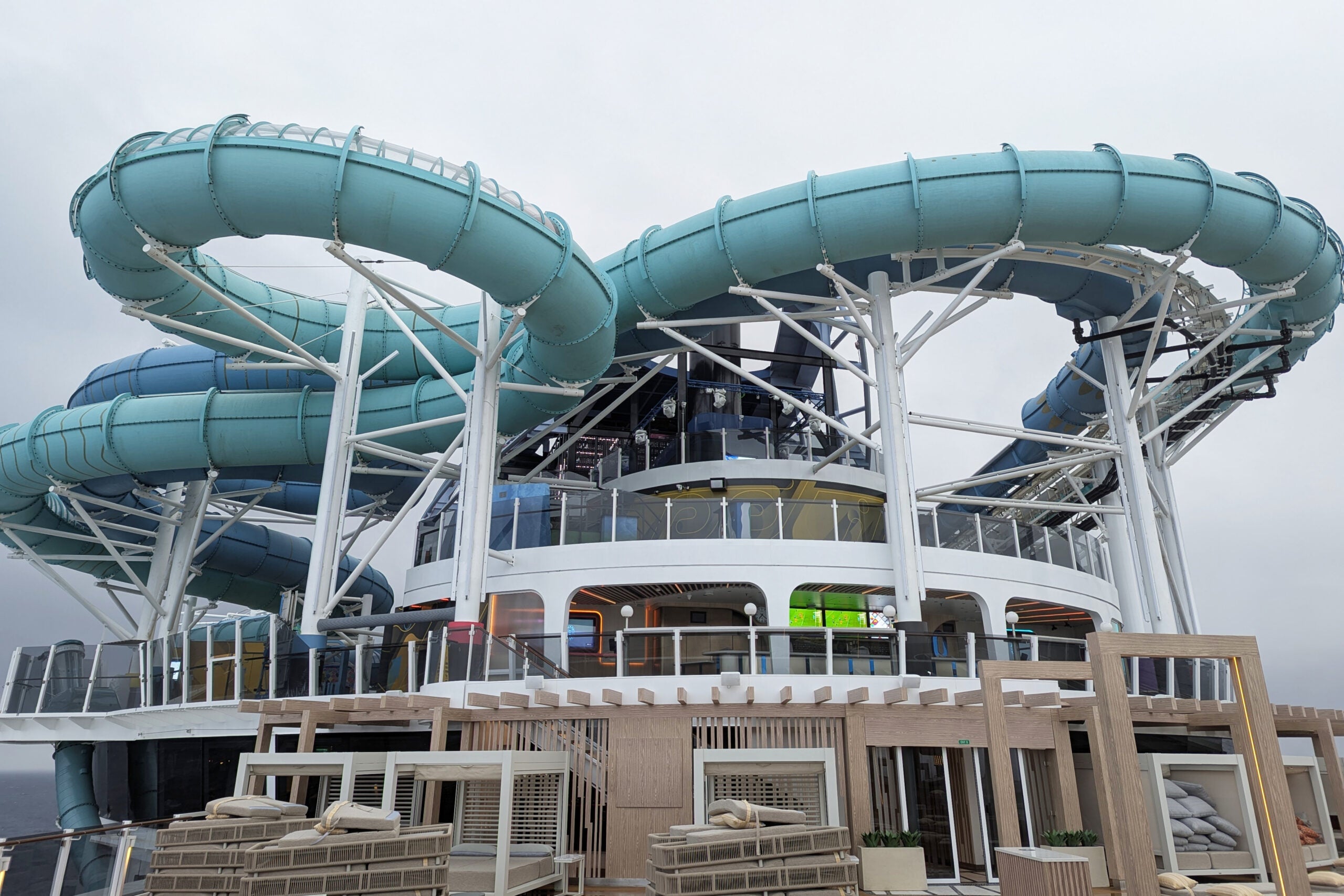 Waterslide tubes above a cruise ship pool deck
