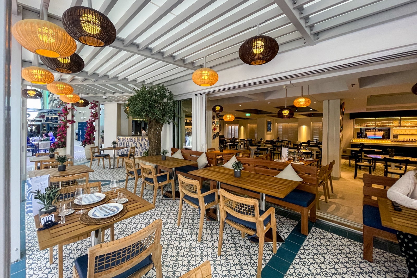 Paxos outdoor dining under a pergola. MSC World America