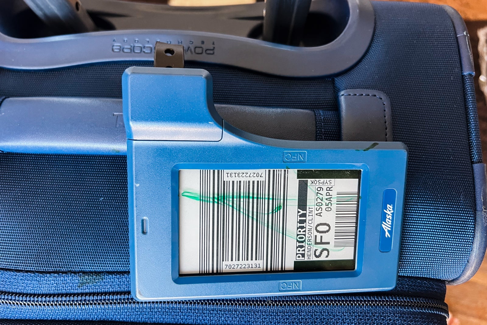 suitcase with digital bag tag