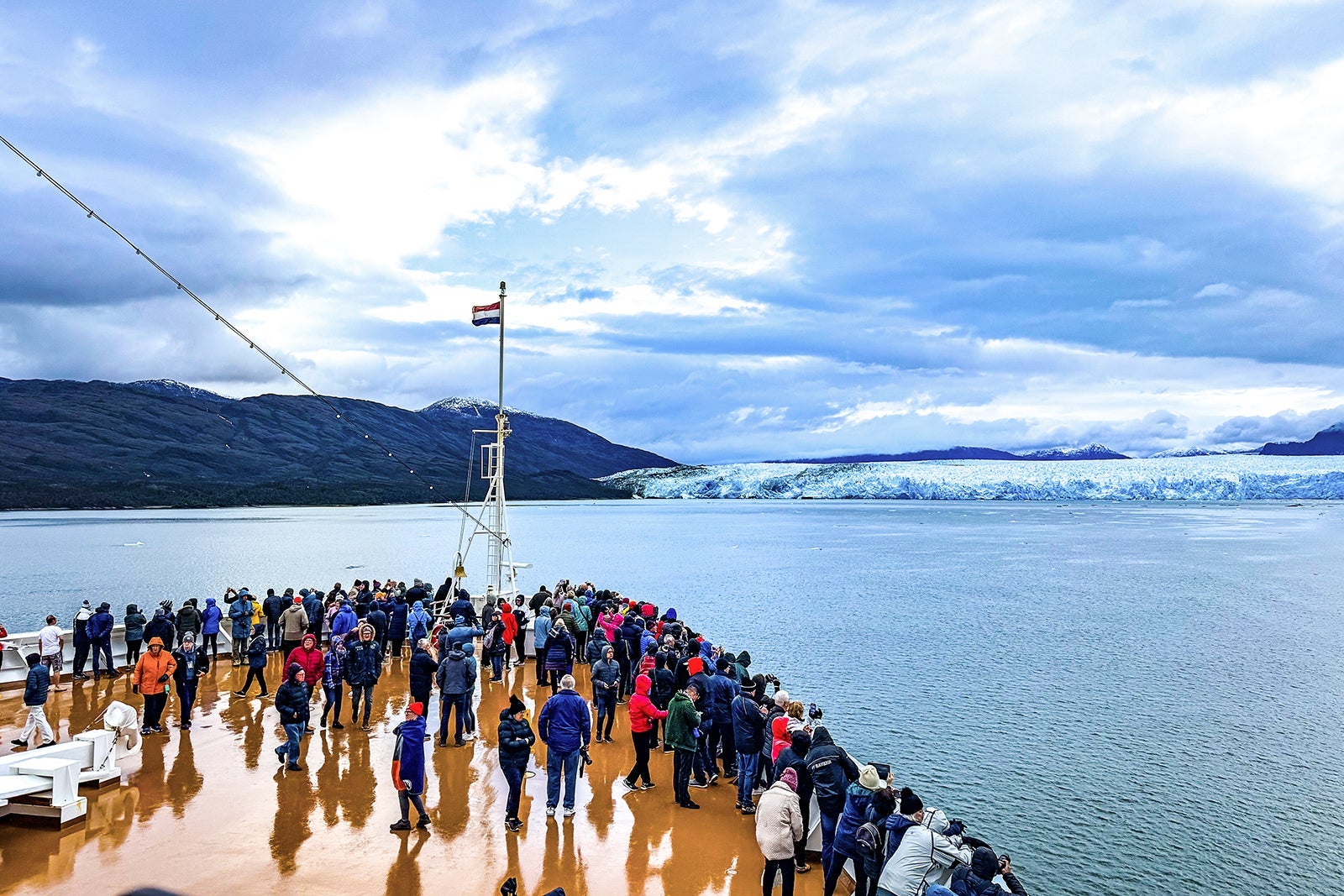 Group of passengers at bow on Holland America ship near Pio XI G