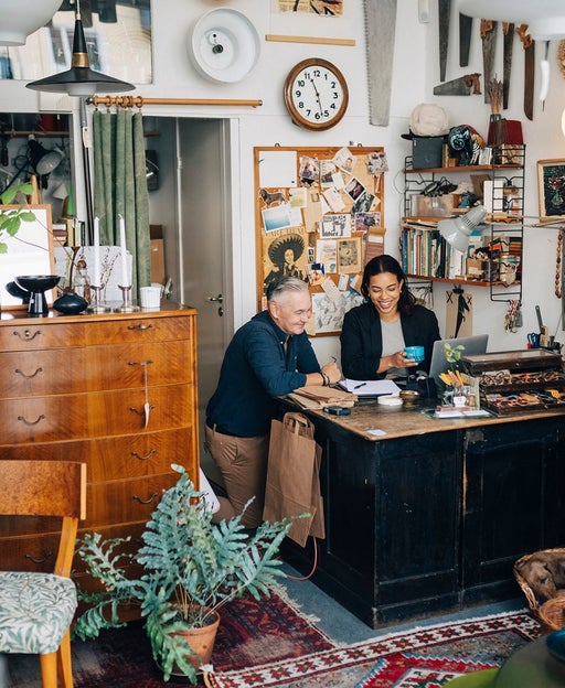 business owner sitting store front