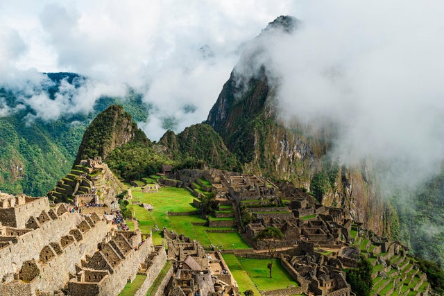 Machu Picchu in the clouds in Cusco, Peru.