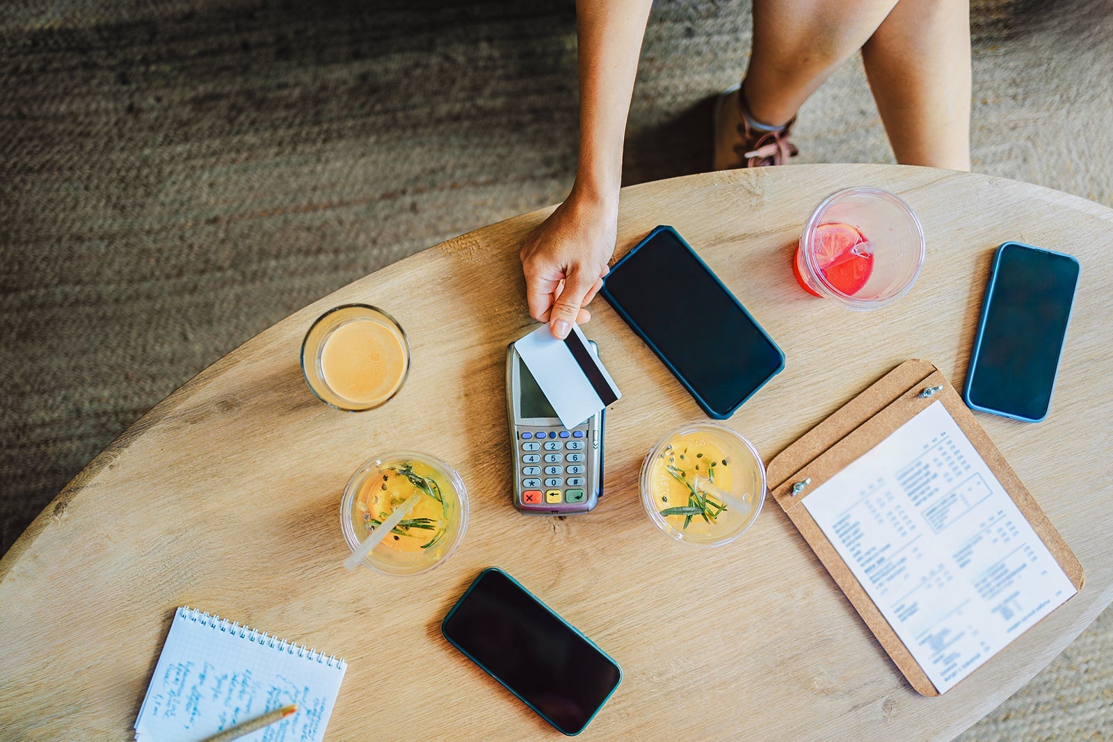 person swiping credit card