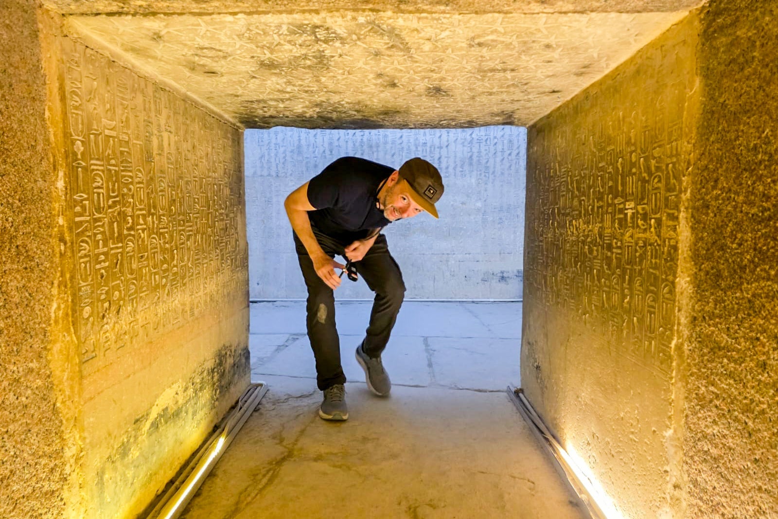 TPG's Gene Sloan stooping low to descend the into a pyramid built for the pharaoh Unas more than 4,000 years ago