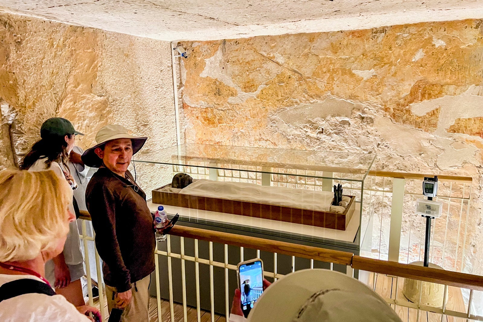 Passengers pose with the mummy of the pharaoh Tutenkhamun, which remains in his tomb