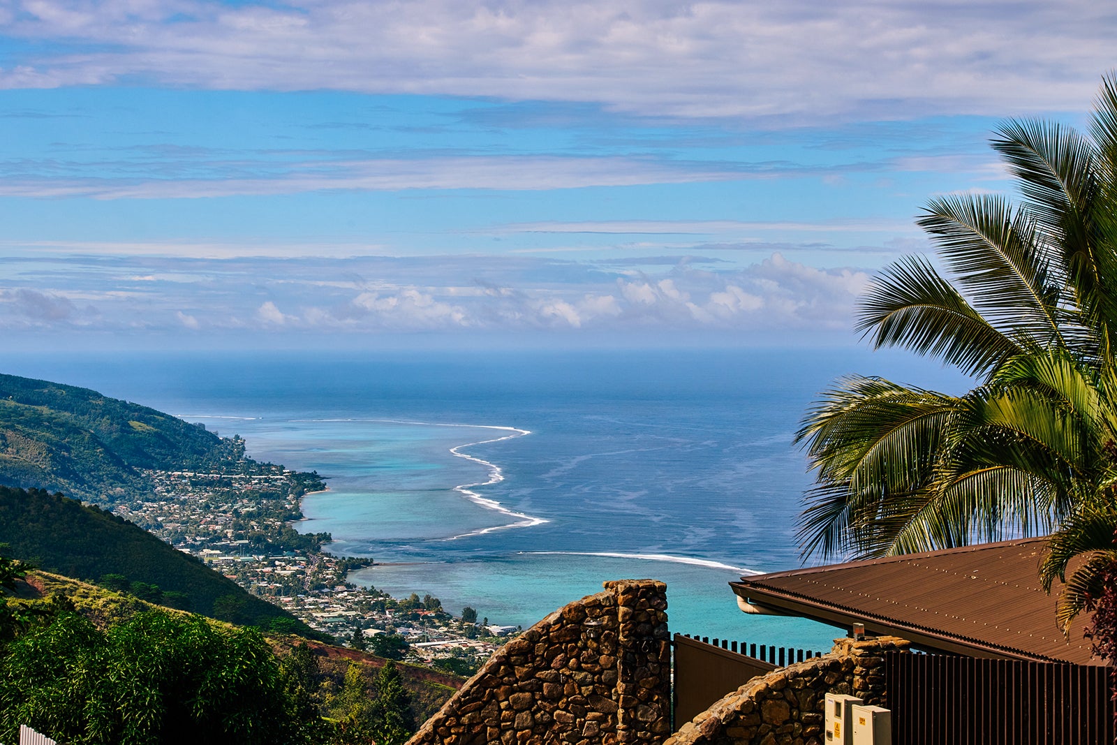 Best places to travel in September 2025 High view from the hillsiide suburb of Puna'auia on Tahiti's west coast looking southwest over the lagoon and coastal suburb of Pea