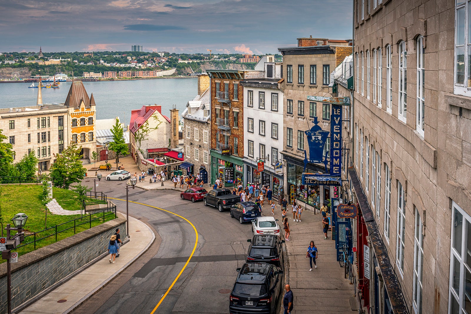 A shopping street and Saint Lawrence river in background in Québec City in Canada.