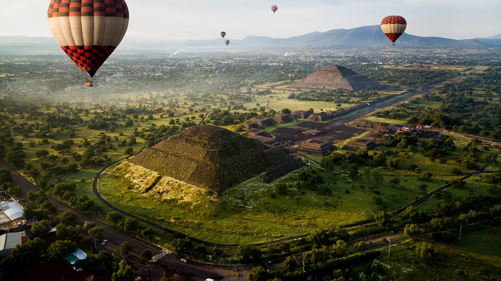 hot air flying in the sky at Teotihuacan