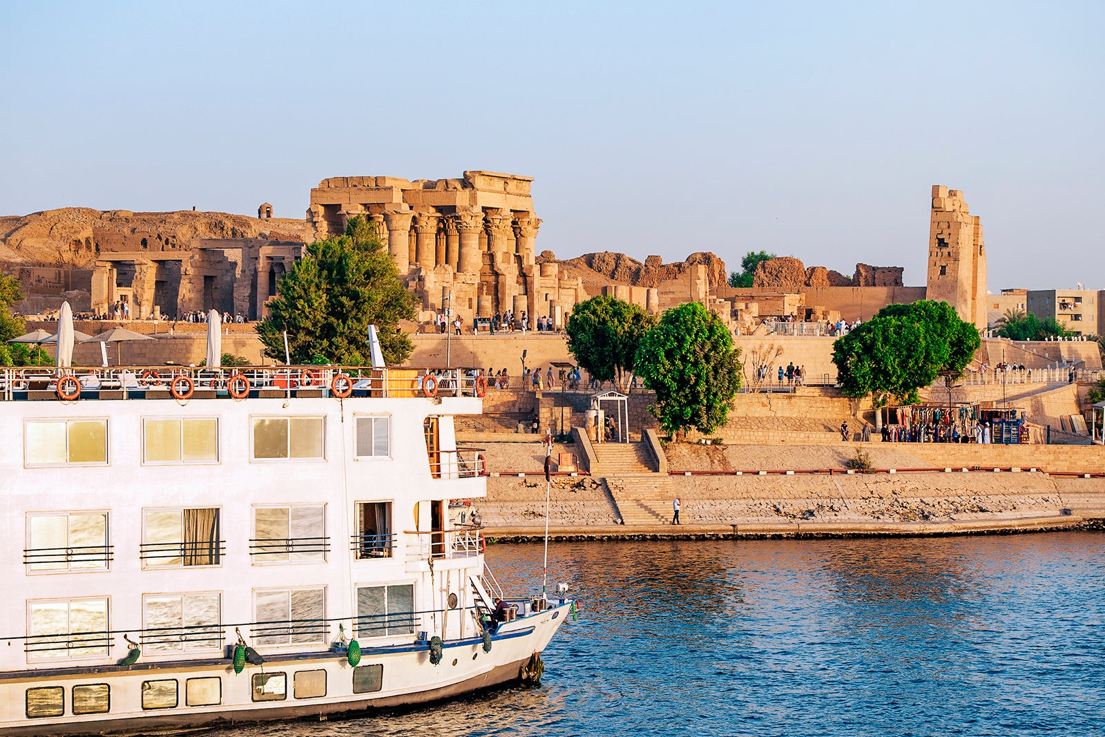 Kom Ombo two-person temple ruled by Aswan, Nile River in Egypt. The Kom Ombo Temple is a double temple of Kom Ombo built on the Ptolemaic dynasty, Upper Egypt in Aswan Province, and is located in Sobek and Horus. The Nile has been and continues to be the lifeline of Egypt. Trade, exchange, agriculture, water and now tourism provide the basic elements of life - from the Upper Nile and its cataracts, along its fertile river bank to the Lower Nile and the Delta. Life has not changed for centuries, and transportation often relies on camels on rivers and Faluca on rivers.