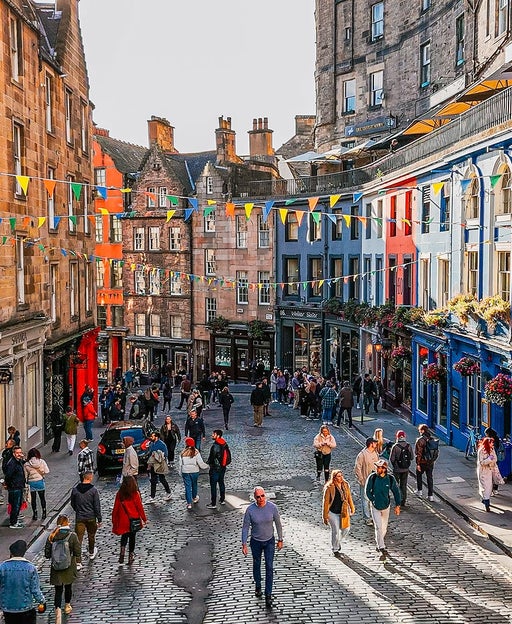 Aerial view of the famous colorful Victoria Street in the Old Town of Edinburgh, Scotland, England, Victoria Street in the United Kingdom, Victoria Street in the old town in Edinburgh Scotland England Crowds of tourists on the Royal Mile,harry potter city
