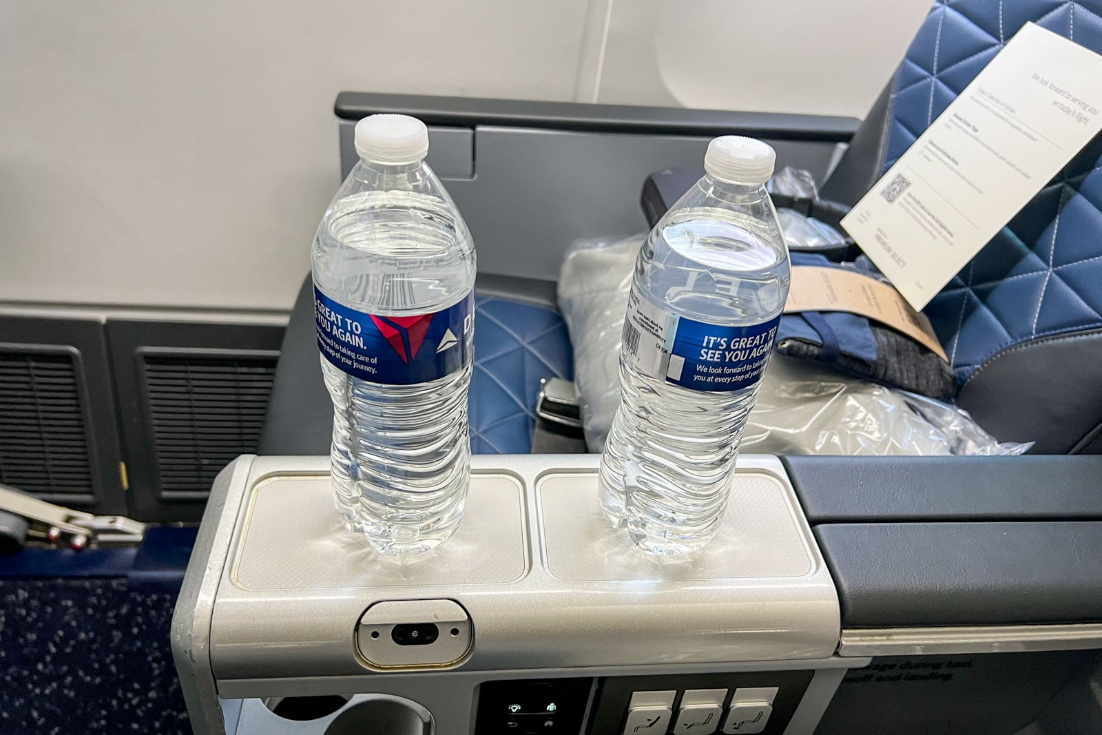 Water at seats in the Delta Premium Select cabin.