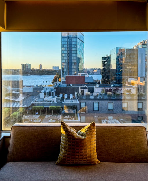 hotel window overlooking city skyline