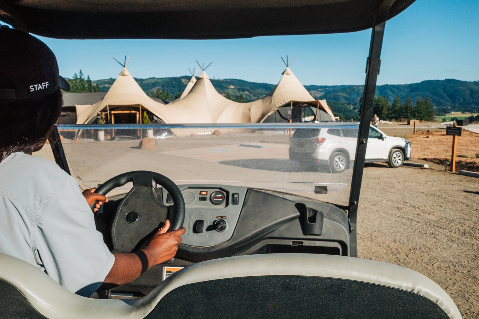 Under Canvas Columbia Gorge Reception Tent with Staff golf cart taking you and your luggage to tent