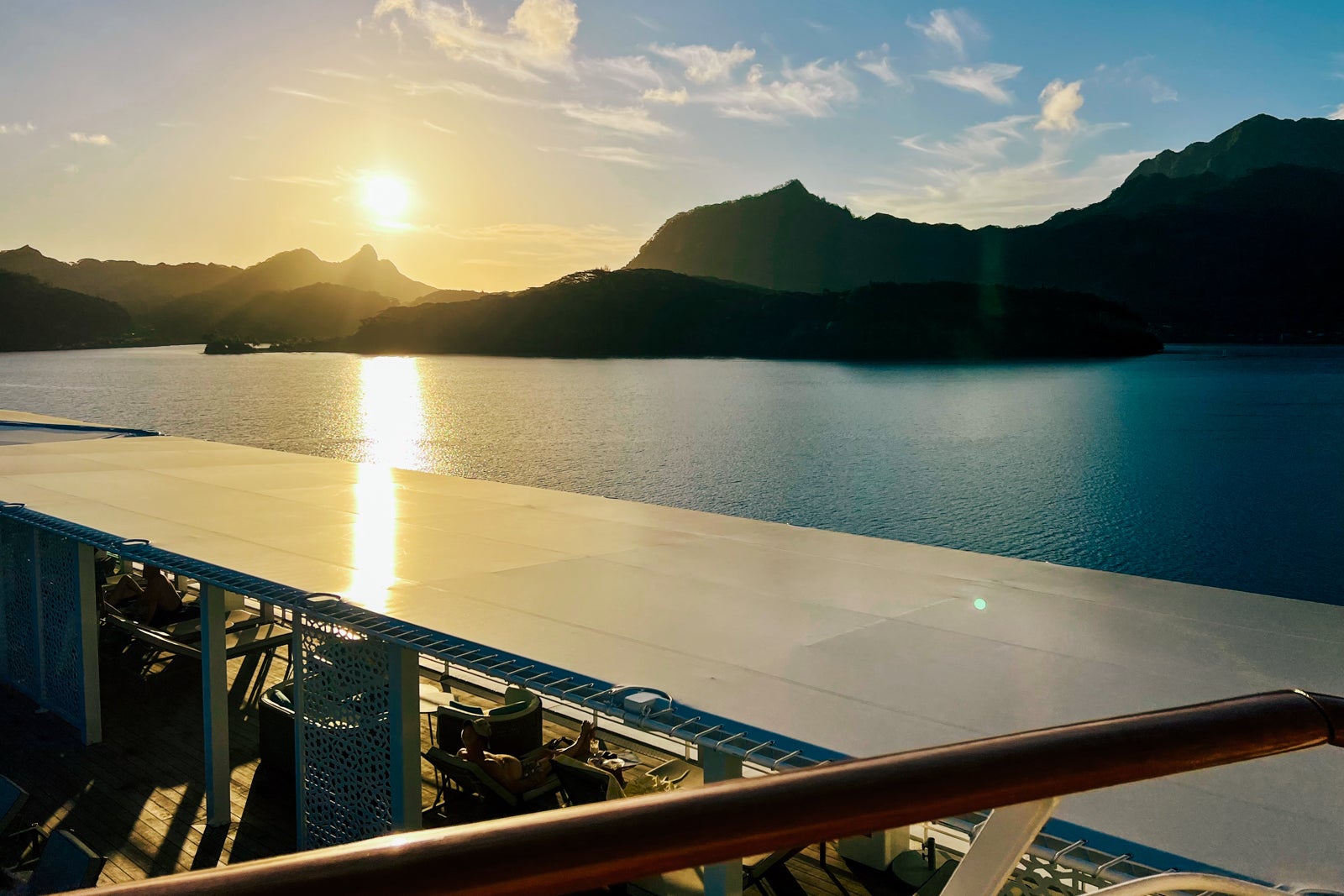 The sun sets over Huahine, as seen from The Gauguin.