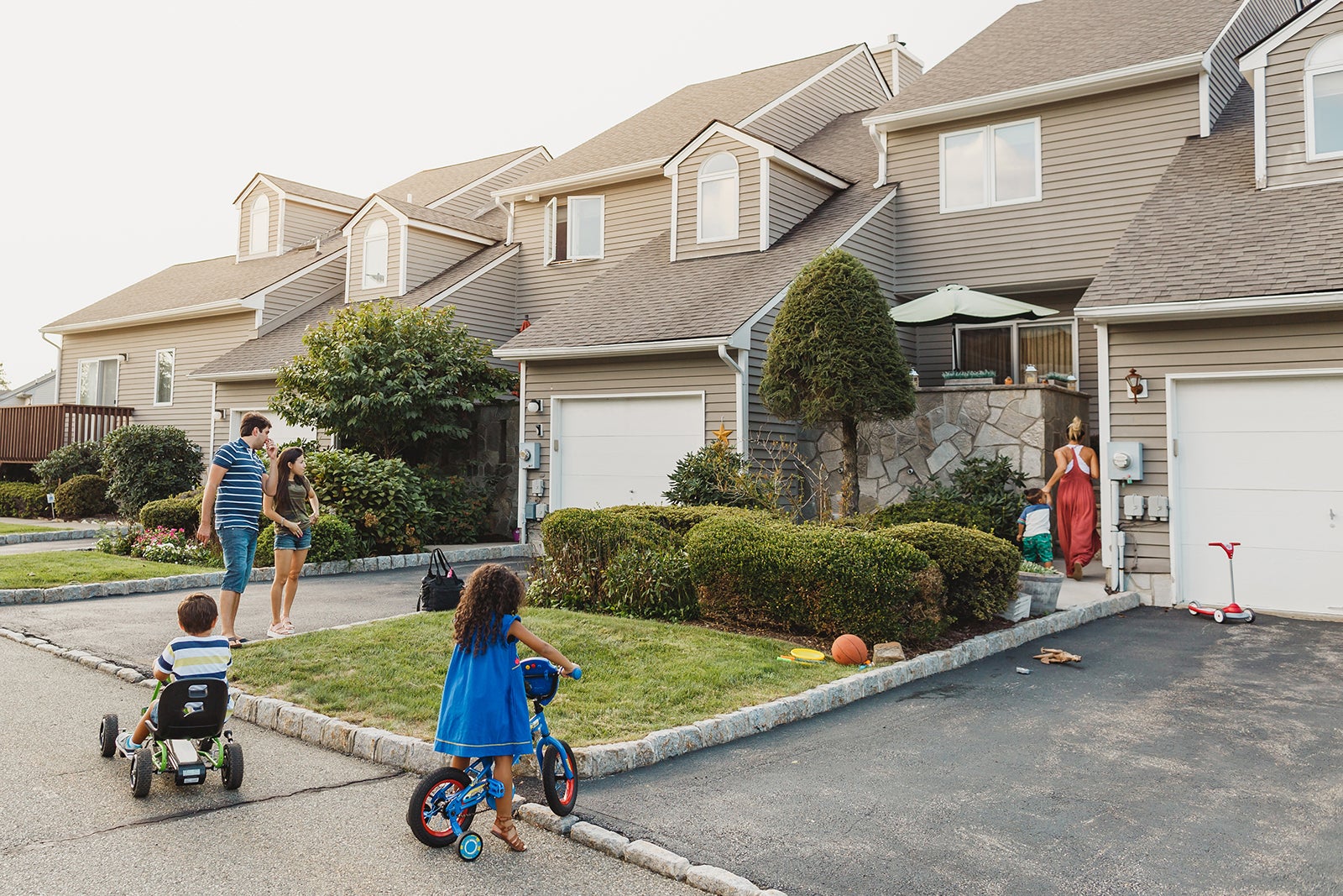 Neighbors talking and kids playing