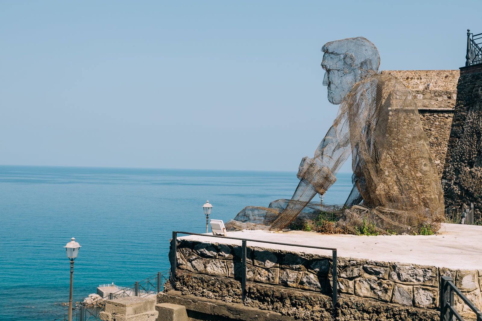 Here's why you should go to Calabria instead of Rome or Milan Edoardo Tresoldi wire sculpture of a man: Il Collezionista di Venti at Via Vittorio Emanuele, 4 in Pizzo, Calabria, Italy