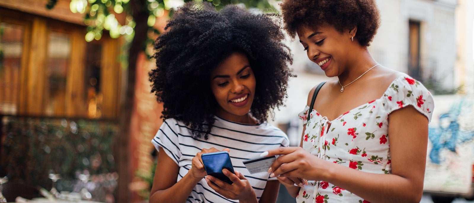 Why the best point redemptions are often practical Two friends shop online on vacation