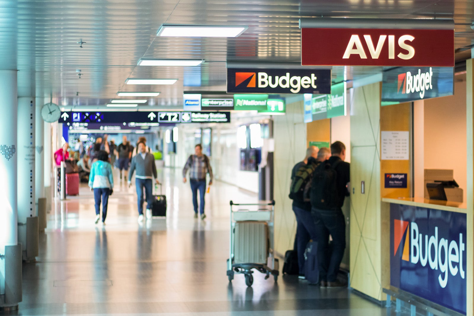 How to avoid getting banned by a car rental company Car rental agencies in Helsinki Airport - Blurred people waitin on the the desk