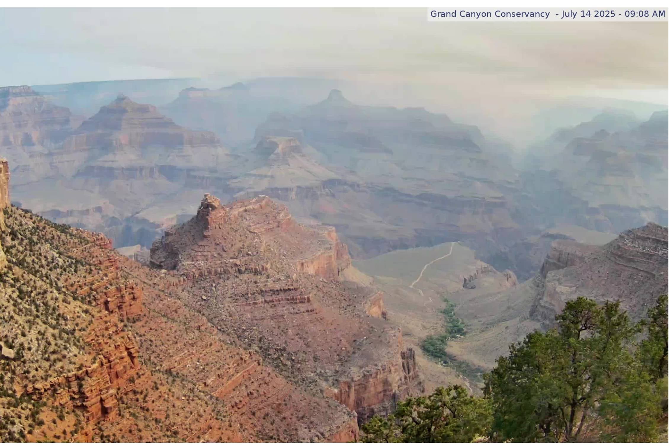 Smoke from the Dragon Bravo fire can be seen in webcam view of Grand Canyon from Kolb Studio webcam on the South Rim looking towards the North Rim.