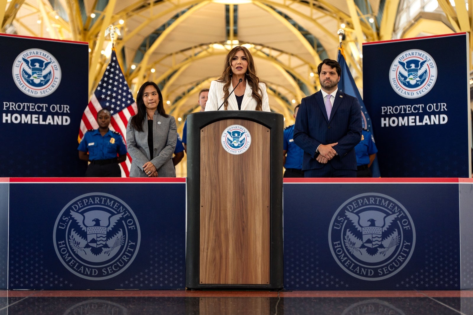 U.S. Secretary of Homeland Security Kristi Noem speaks on July 8 at Ronald Reagan Washington National Airport 