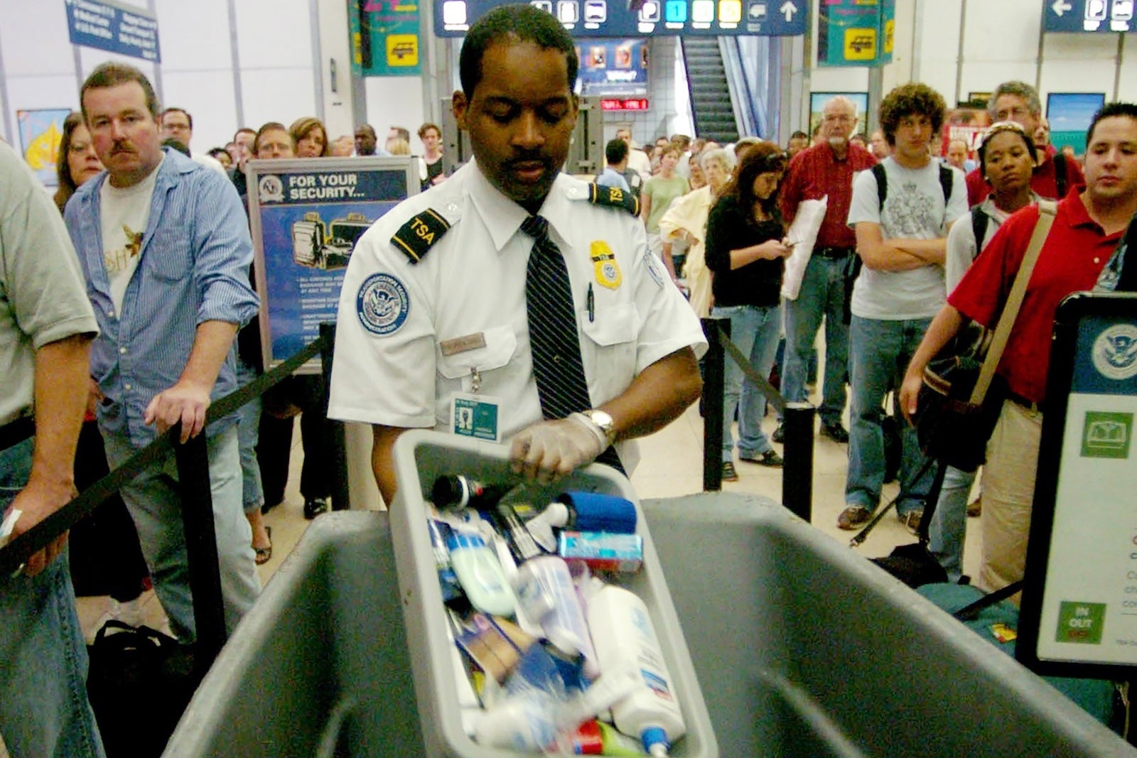 A TSA officer disposes of liquids in 2006 at Chicago's O'Hare International Airport 