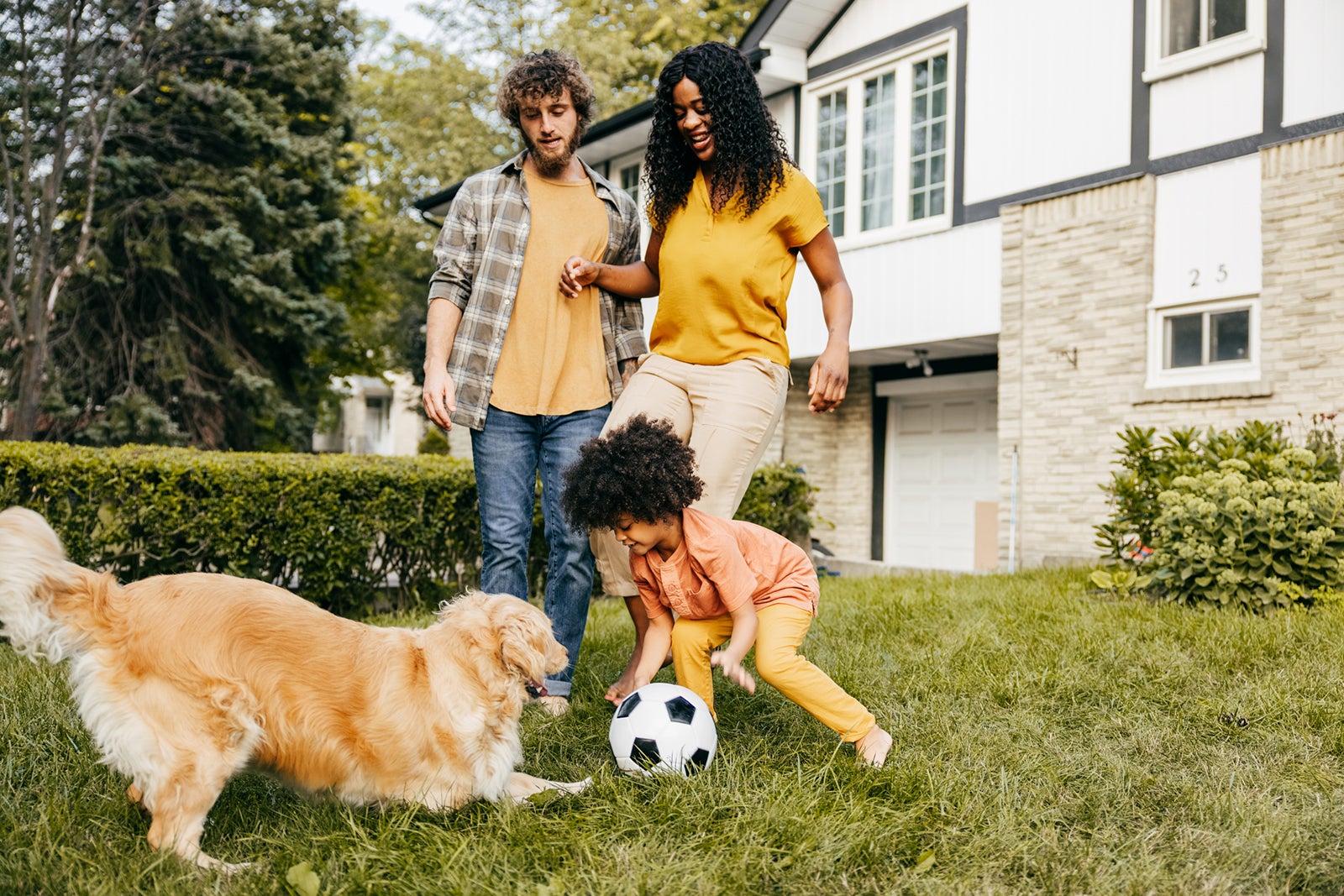 family spending time together outside on their front yard