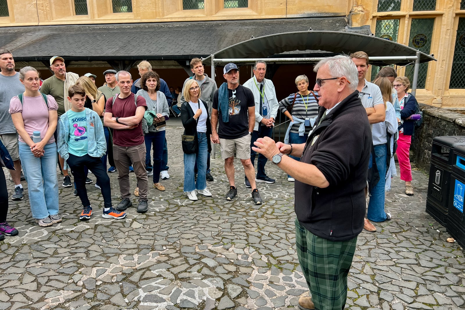 Tourgoers listen to a guide explain the history of Stirling Castle.