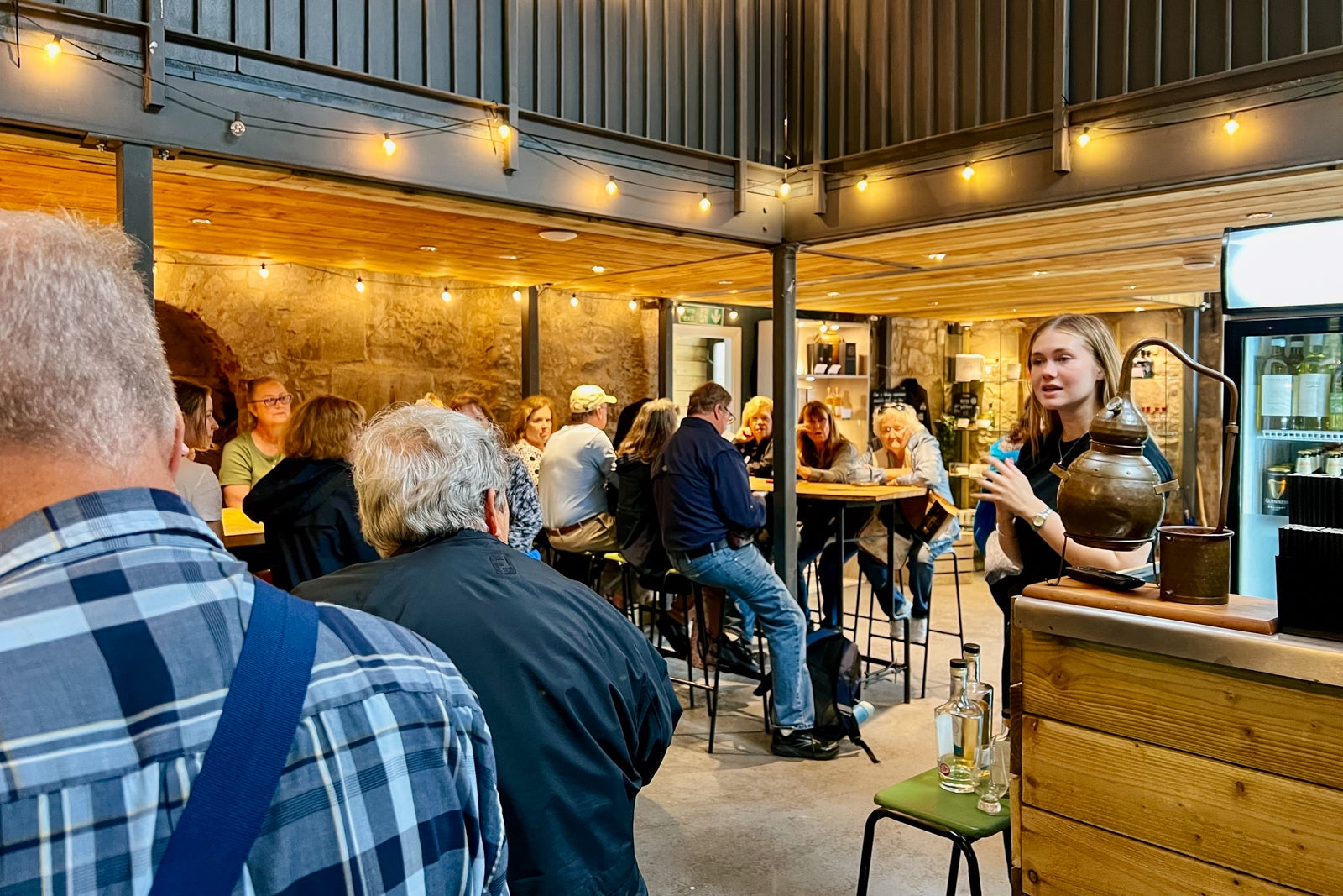 Globus tourgoers sample whiskys at a distillery in Stirling, Scotland.
