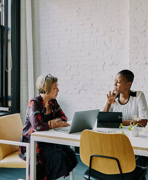 Businesswoman meeting with financial advisor in office conference room