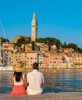 Couple sitting together seaside in Croatia