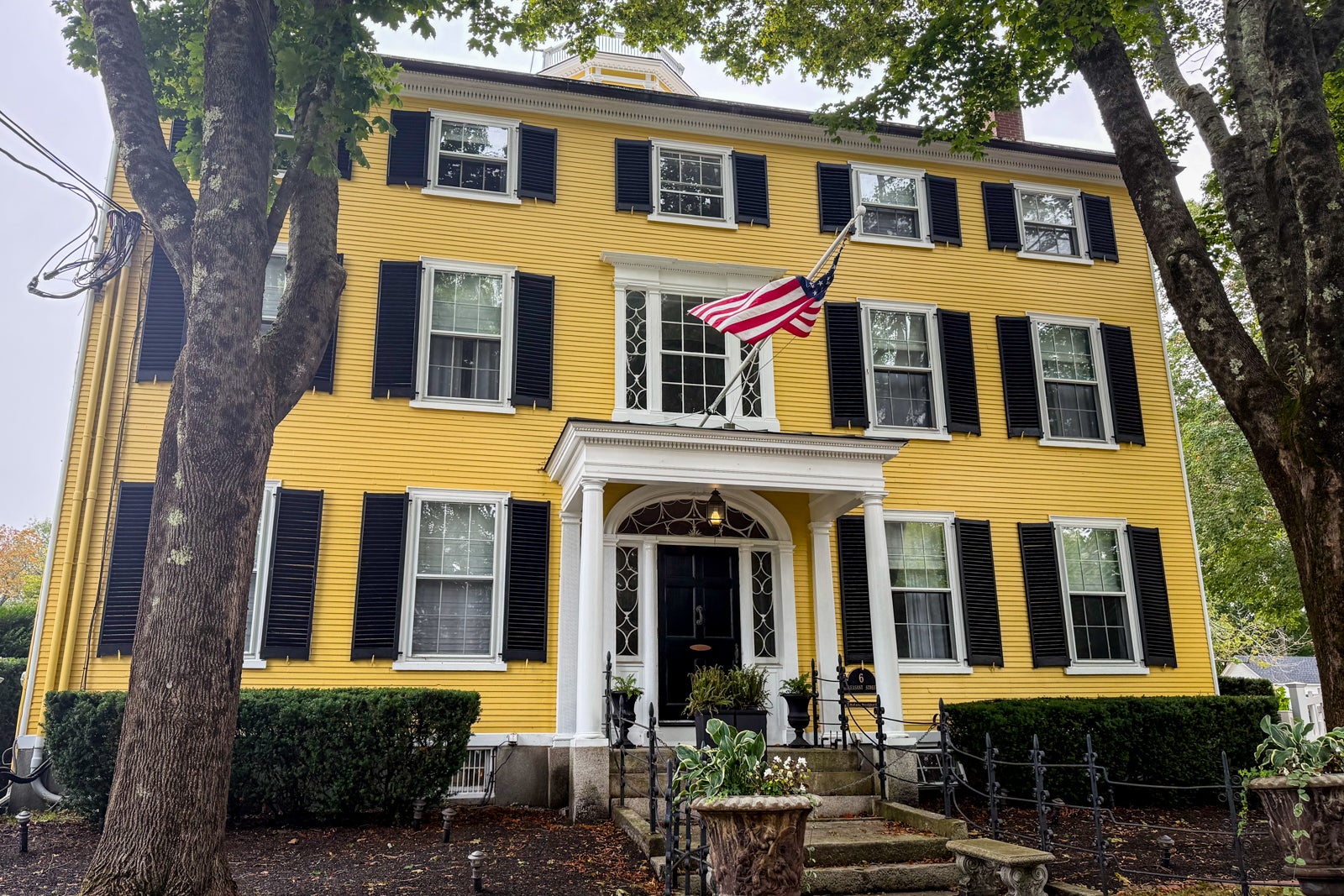 yellow house with black shutters