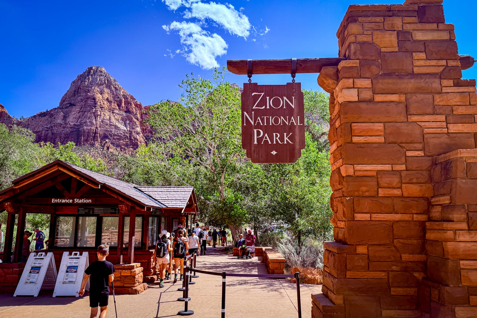 entrance to Zion National Park with red rocks in the background