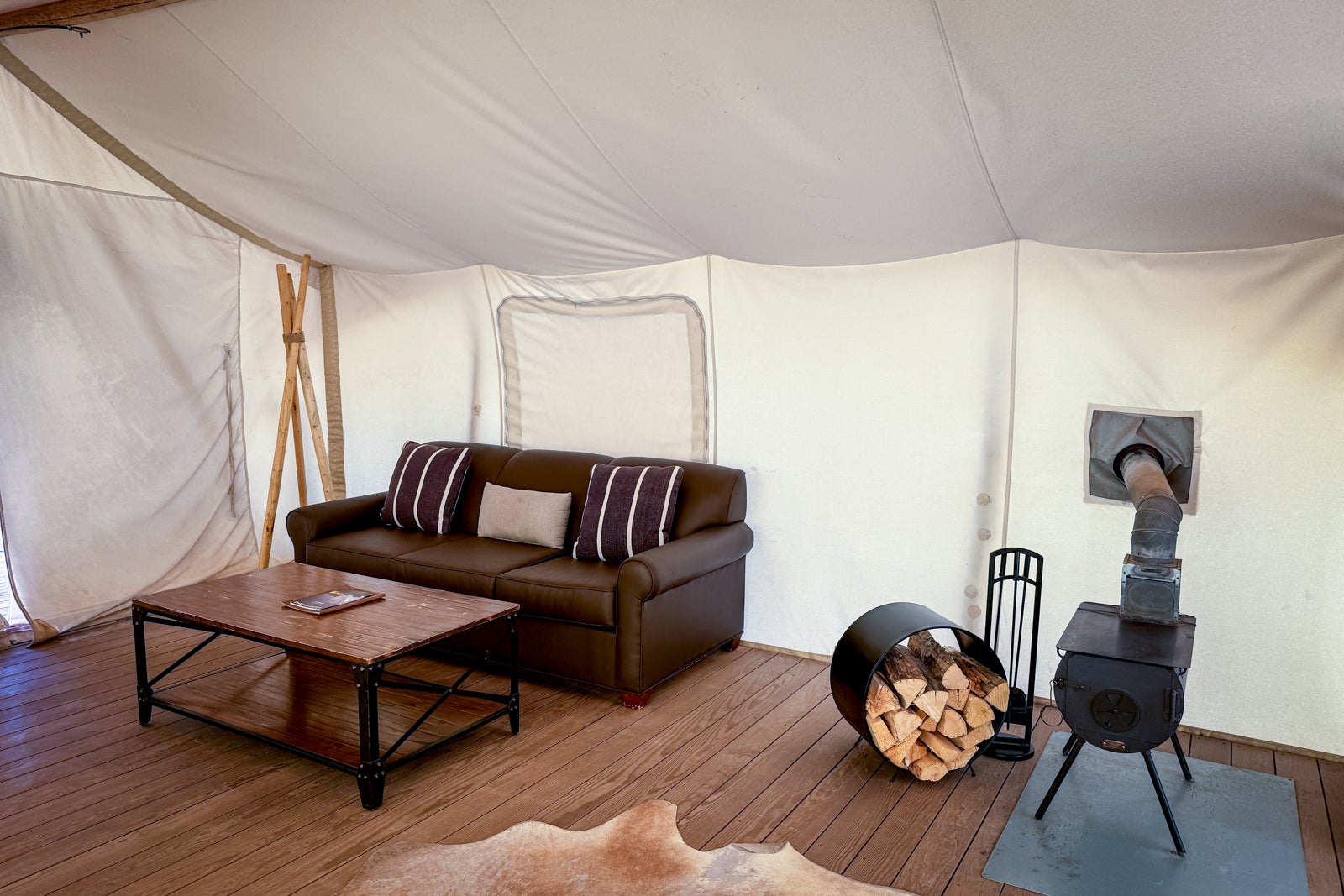 tent with couch and wood burning stove