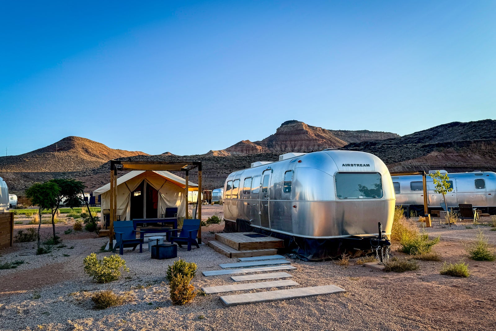 airstream with a tent next to it