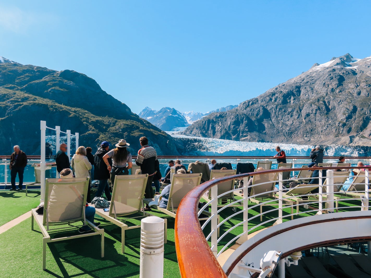 national park rangers in front of glacier