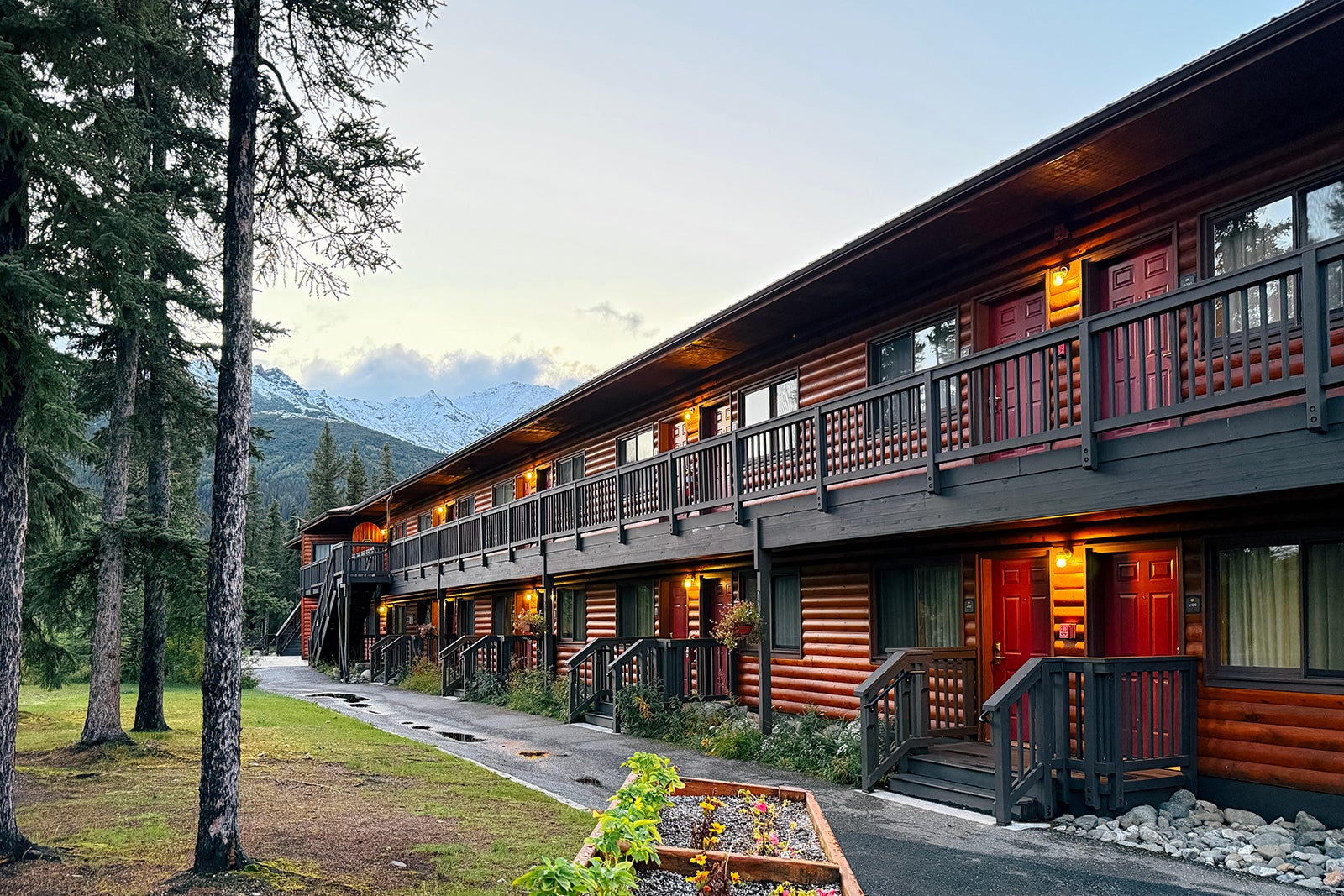 exterior of log building where guest rooms are at Denali Princess Wilderness Lodge
