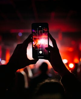 Rock band performing on stage at night club