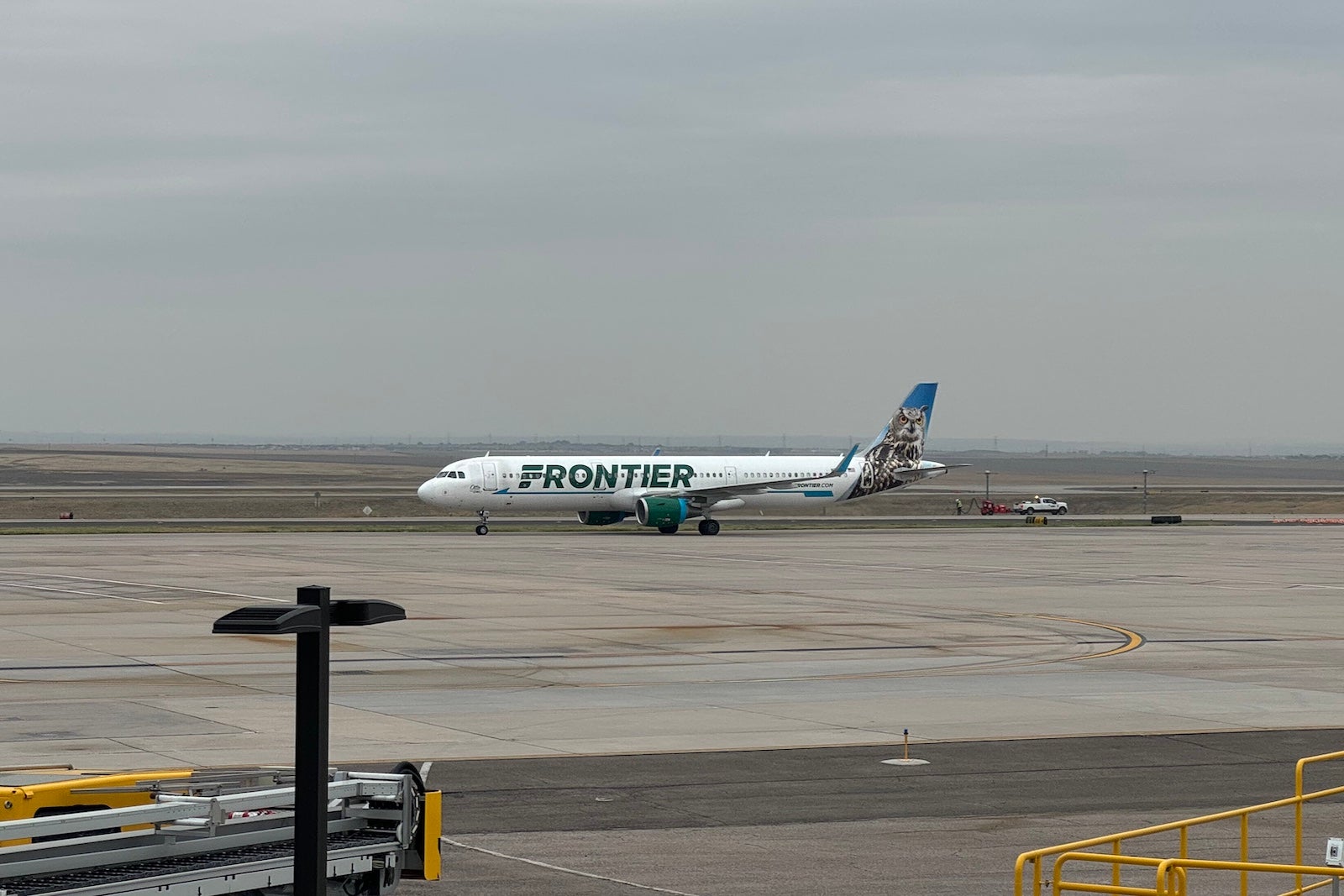 A Frontier Airlines aircraft taxis at Denver International Airport