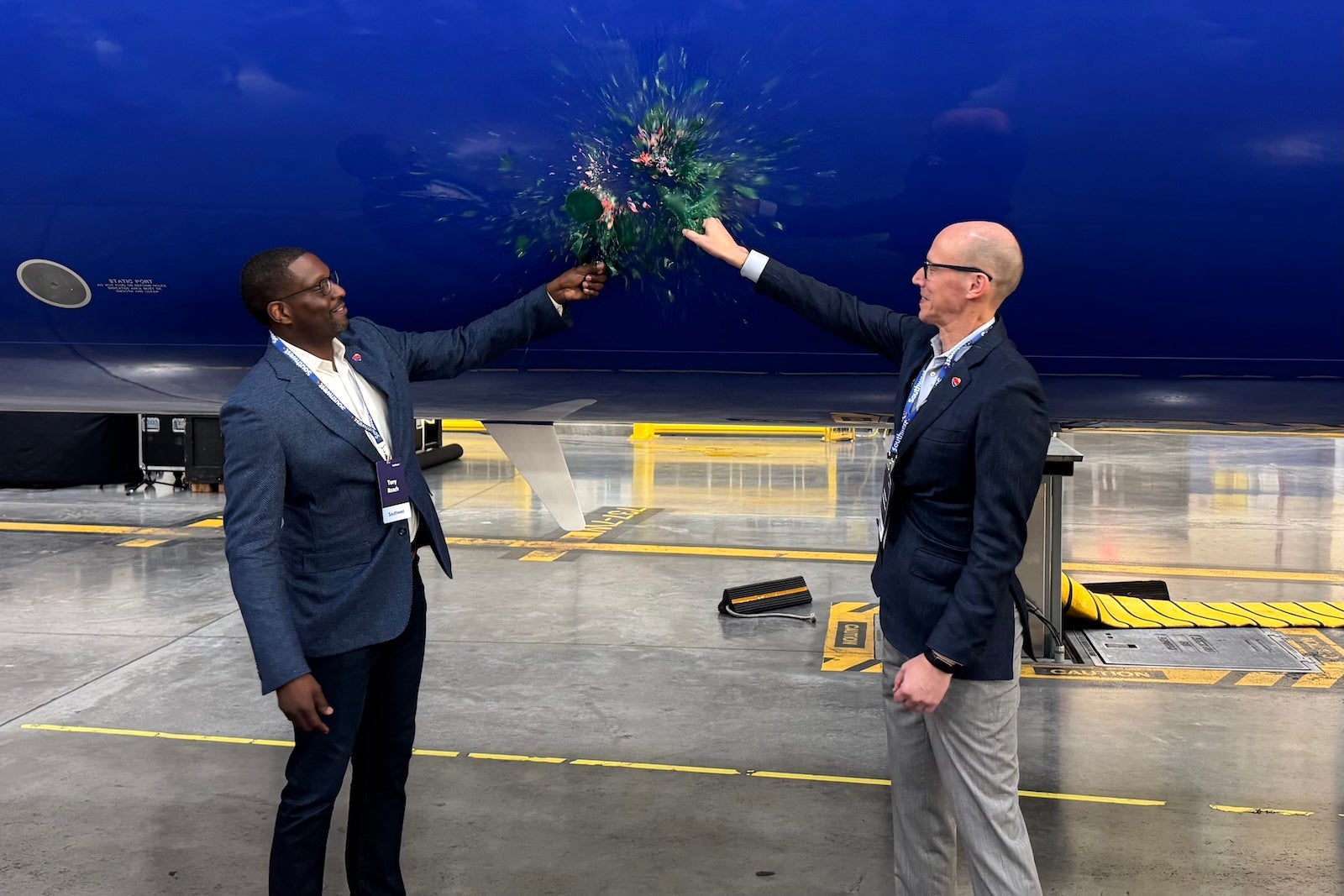 Southwest Airlines Chief Customer and Brand Officer Tony Roach (left) and Chief Operating Officer Andrew Watterson ceremonially christen the carrier's new Boeing 737 MAX 8