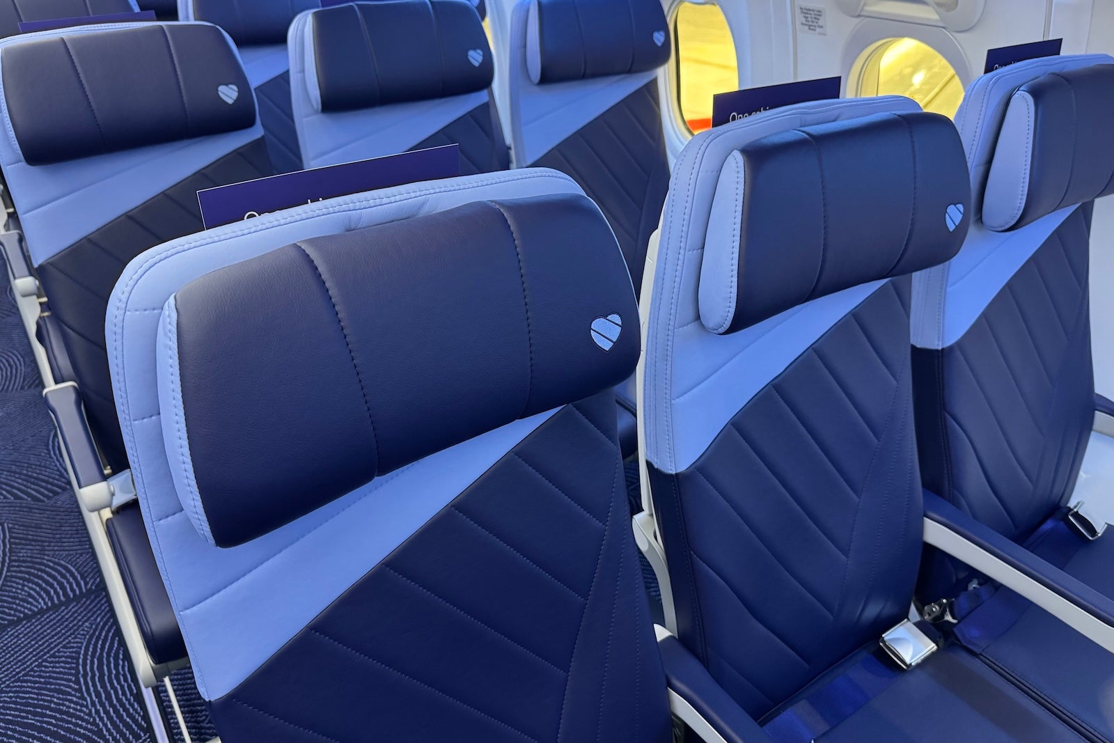 blue seats on a Southwest Airlines plane with a paler blue around the headrest
