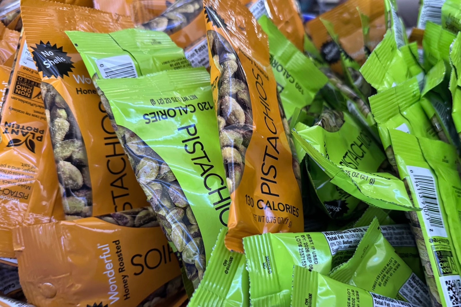 green and tan bags of pistachios