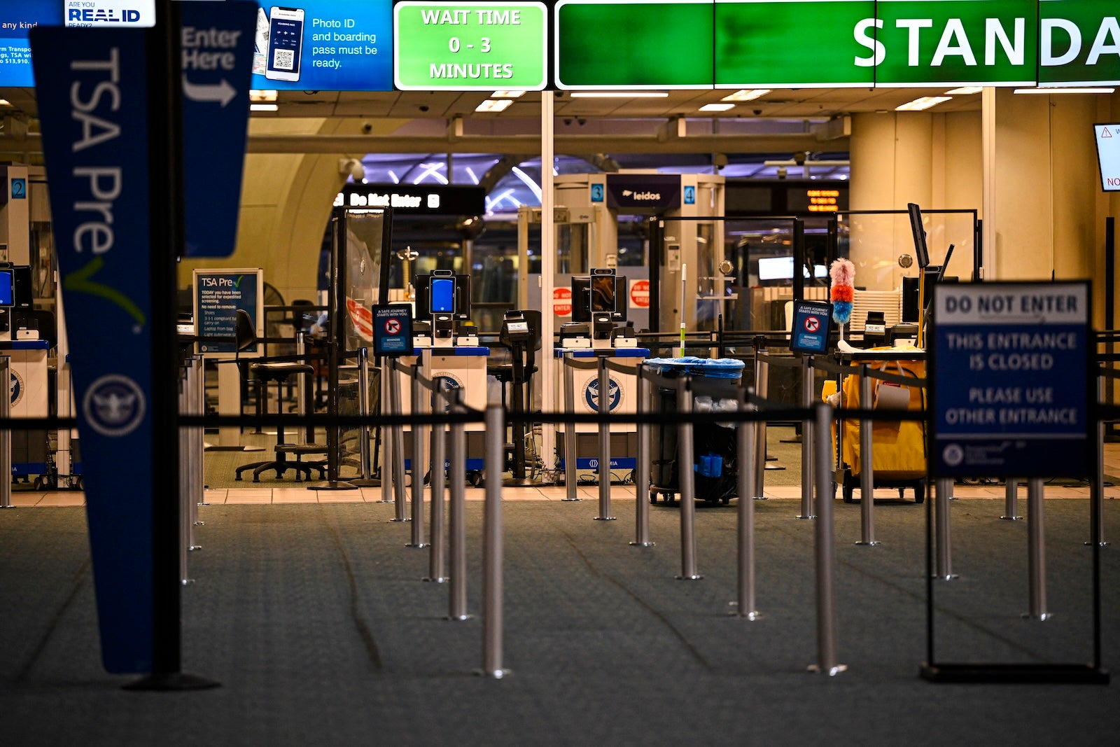 The TSA counter stands empty at Orlando International Airport in Orlando, Florida on October 30, 2025. Flights at Orlando International Airport faced major delays on October 30, after the Federal Aviation Administration (FAA) said the airport had no certified air-traffic controllers in its tower, forcing arrivals to be halted or severely delayed amid the ongoing US government shutdown. Air traffic controllers -- seen as "essential" public servants -- are kept at work during government shutdowns, but higher numbers are calling in sick rather than toiling without pay, leading to shortages.