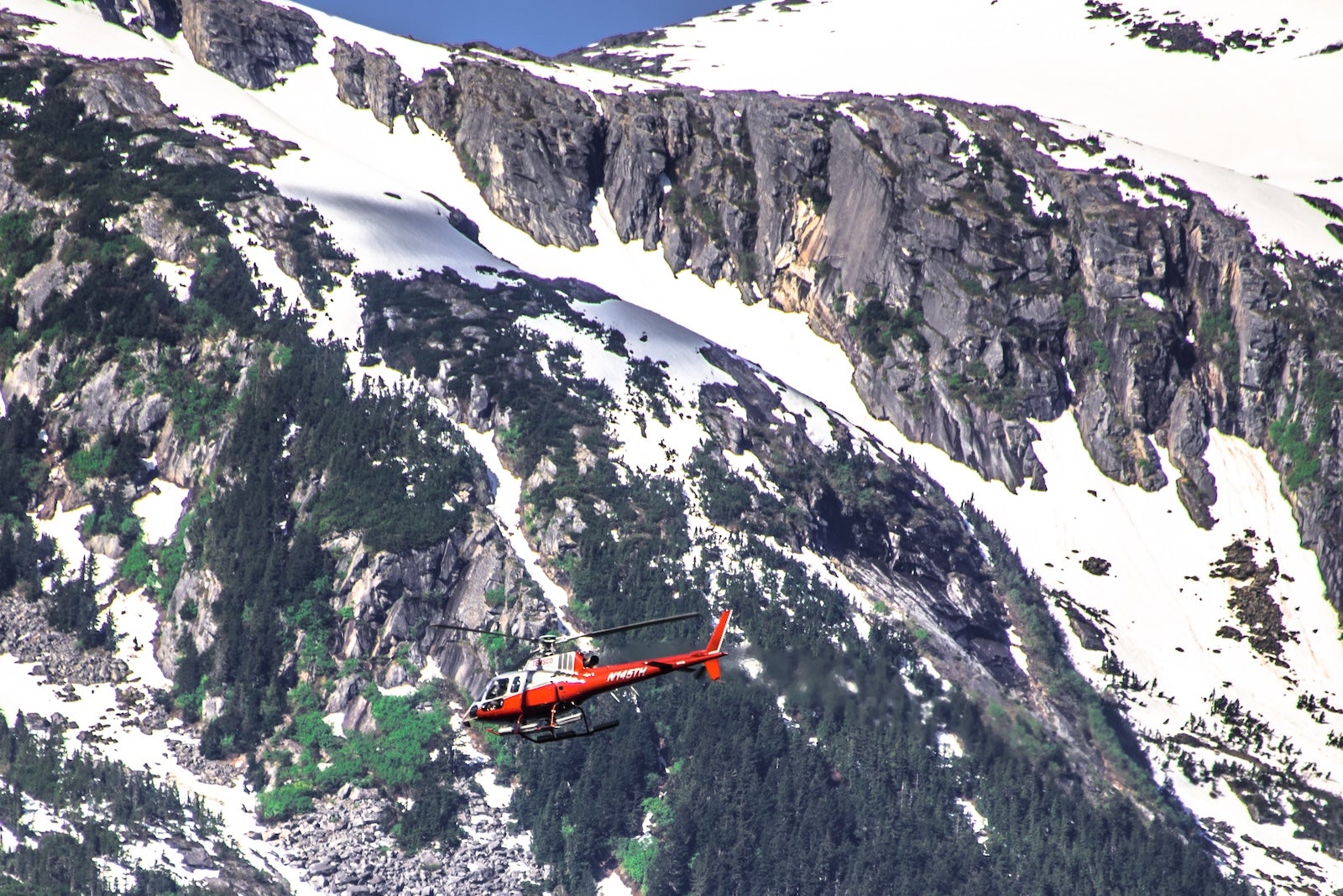 Skagway, USA - June 15, 2024: Glaciers could be difficult to reach. Helicopter tours allow you to get up-close views and unique personal experience such as landing and walking on the ice.