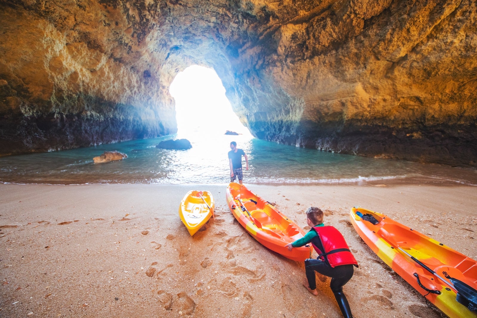 Father and son together paddling in kayak