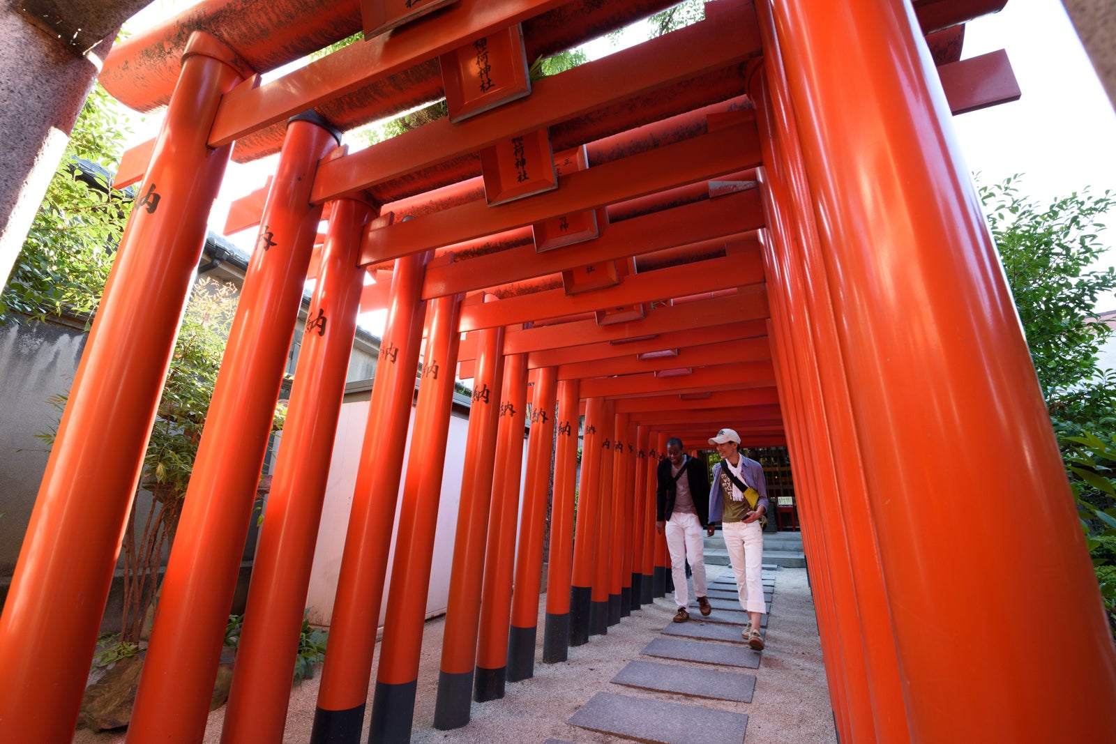 Visitors walk through Torii gateways at the Kushida shrine in Fukuoka, Japan
