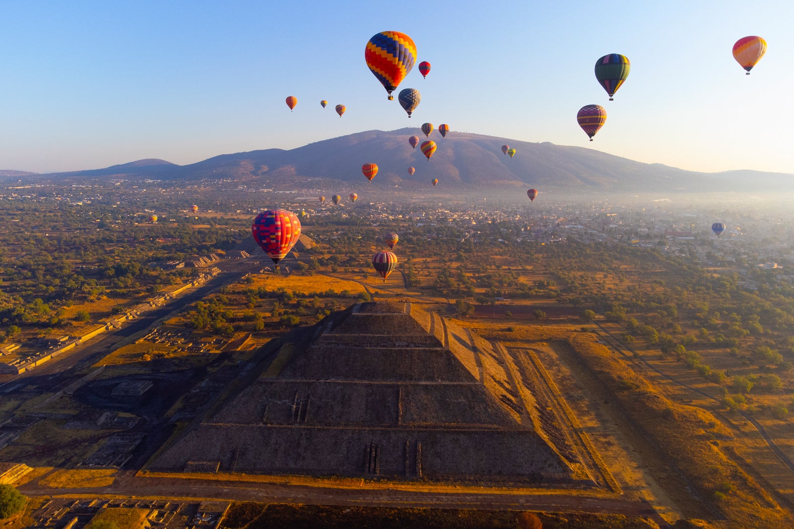 Sunrise on hot air balloon over the Teotihuacan pyramid