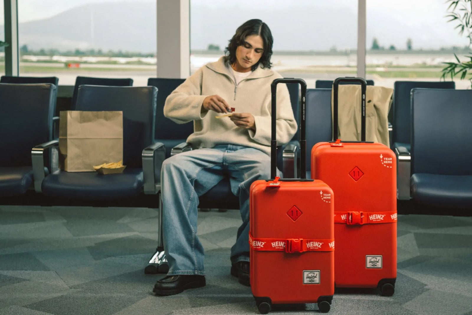 man with luggage at airport