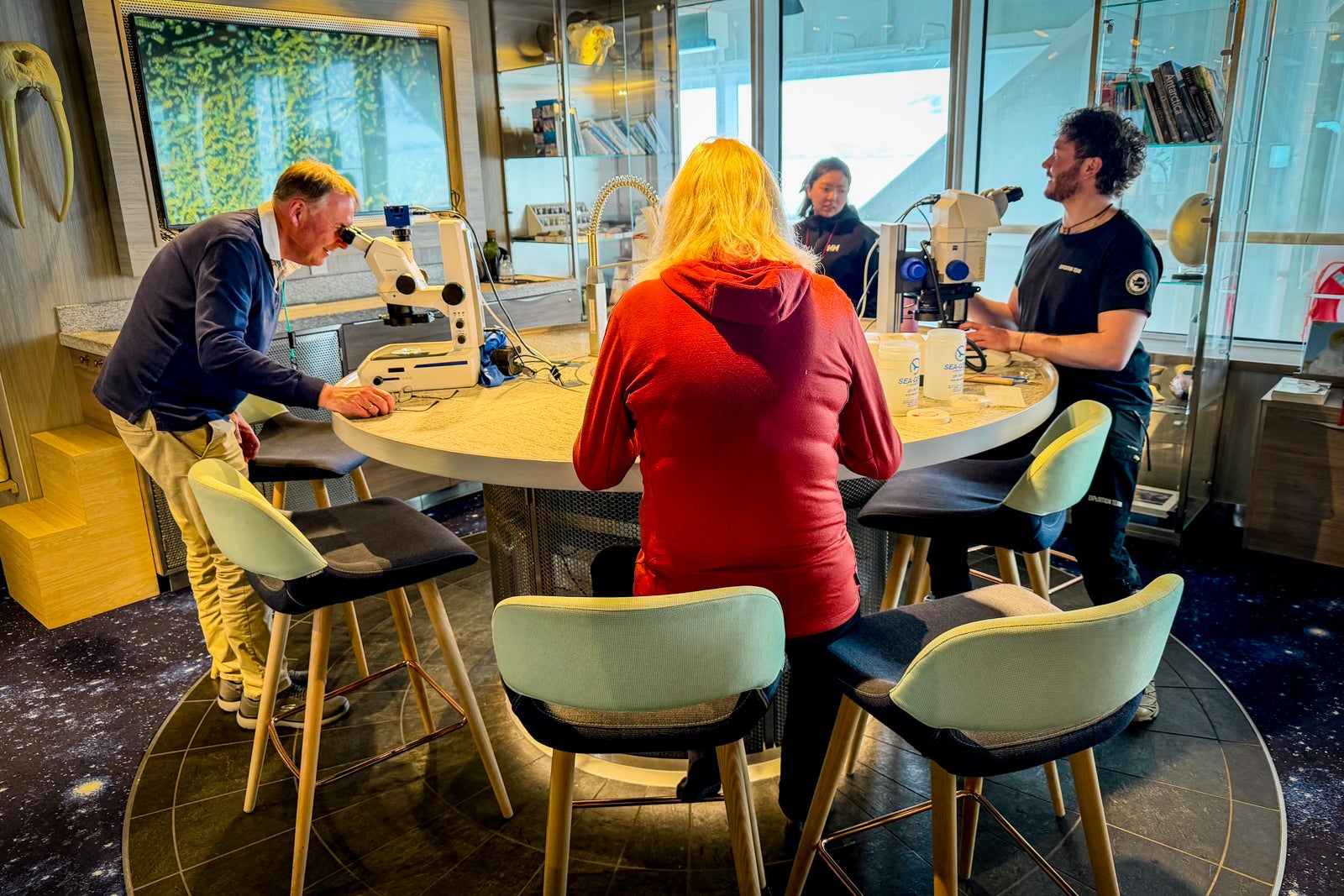 Roald Amundsen passengers take part in a science workshop on board the ship.