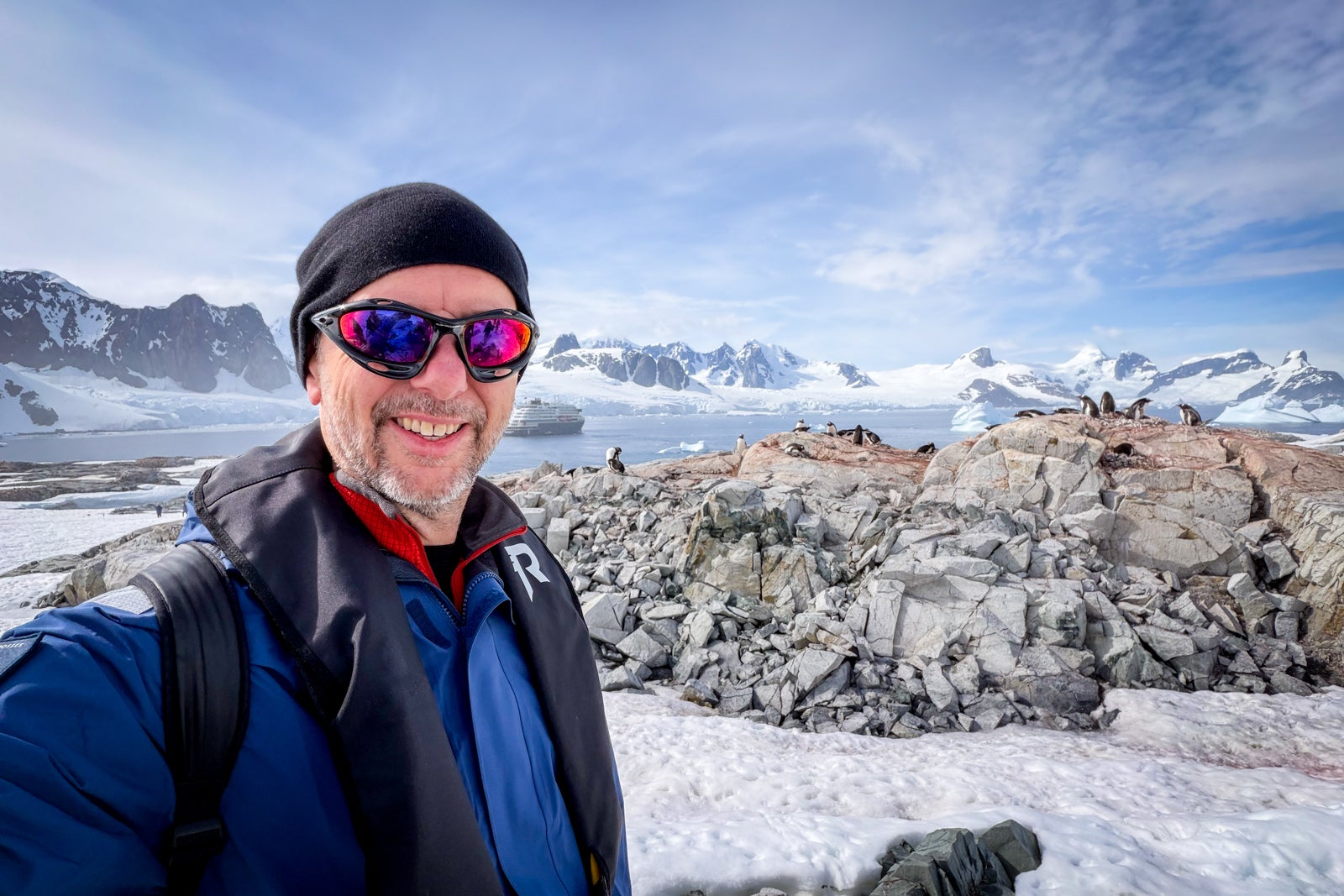 TPG's Gene Sloan in front of a penguin colony at Petermann Island.