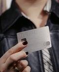 person holding bilt palladium card